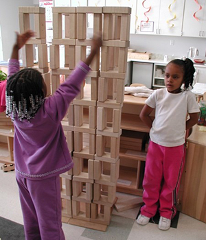child building with blocks