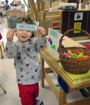 Kid playing with a basket.