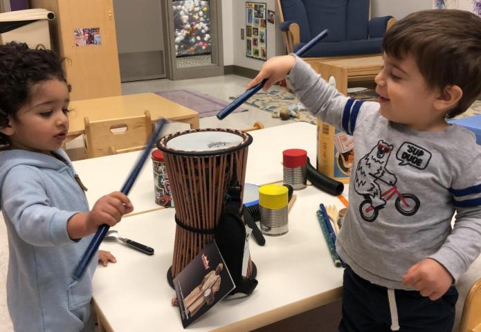 Children playing with percussion instruments.