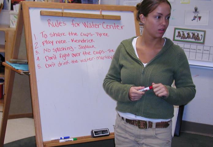 Instructor at a white board.