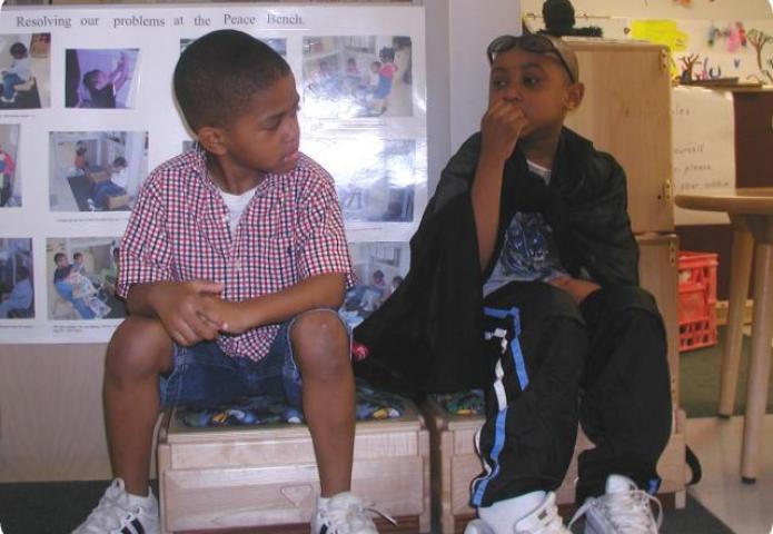 Two boys listening.