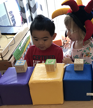 Toddler playing with blocks.