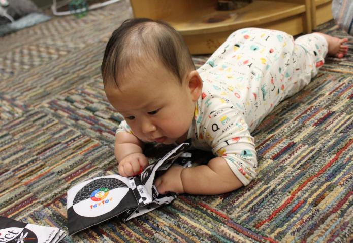 Child crawling on the floor.