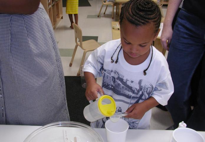 Student pouring a cup.