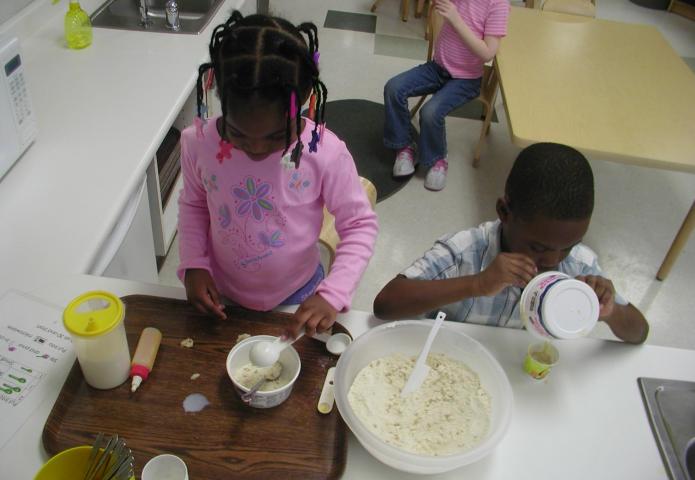 Students mixing ingredients.