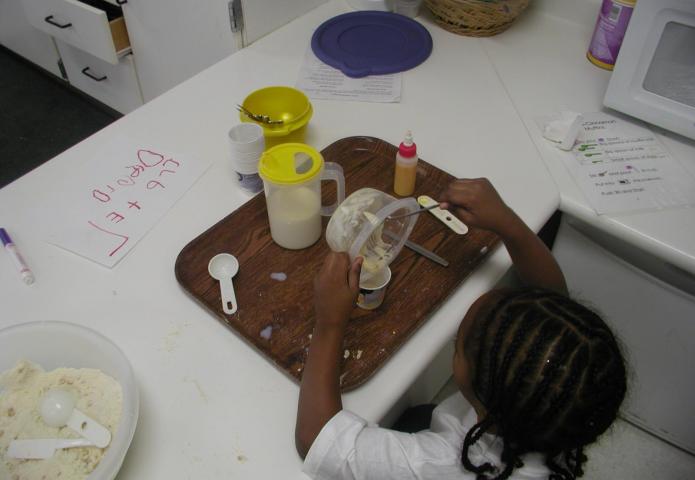 Students mixing ingredients.