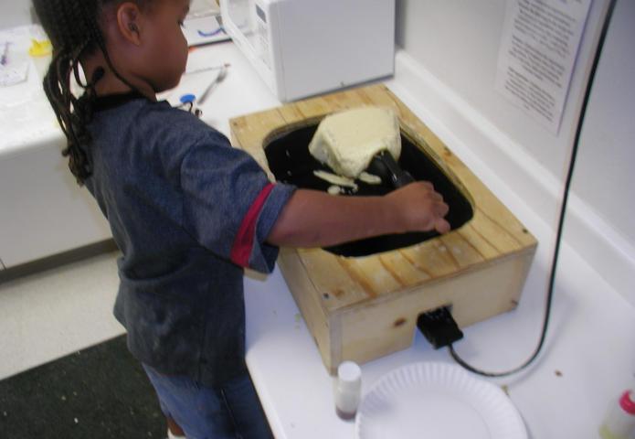 Student flipping a pancake.