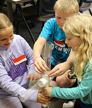 Kids playing with tubes.