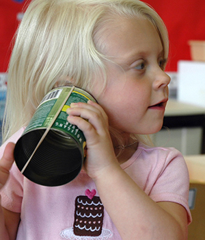 Kid using a phone can.