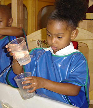 Kids playing with water cups.