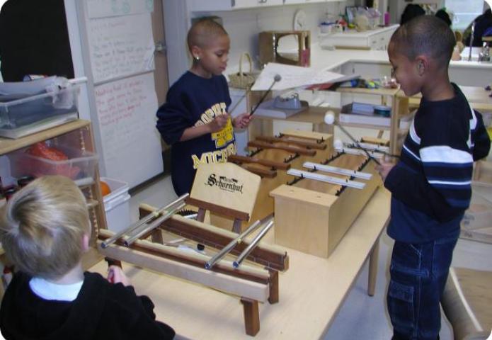 Children playing xylophone.