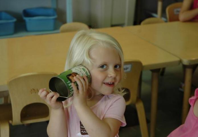 Child using an empty can.