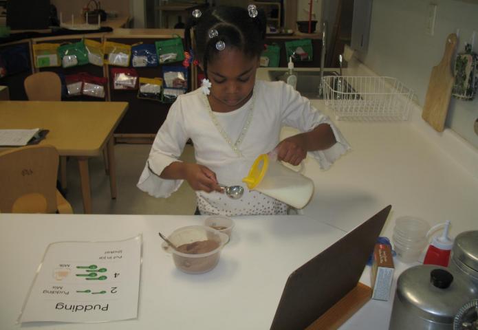 Mixing pudding in a classroom.