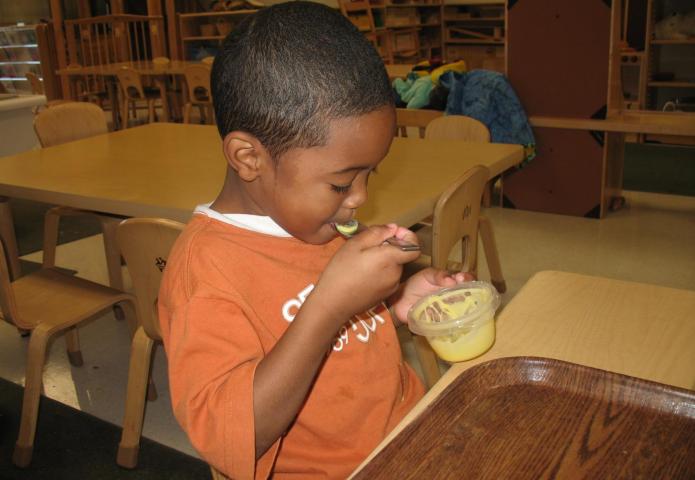 Eating delicious pudding.