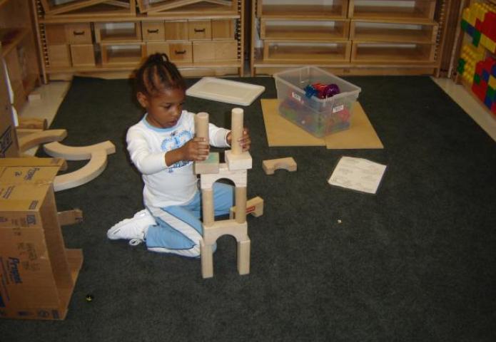 Child stacking blocks.