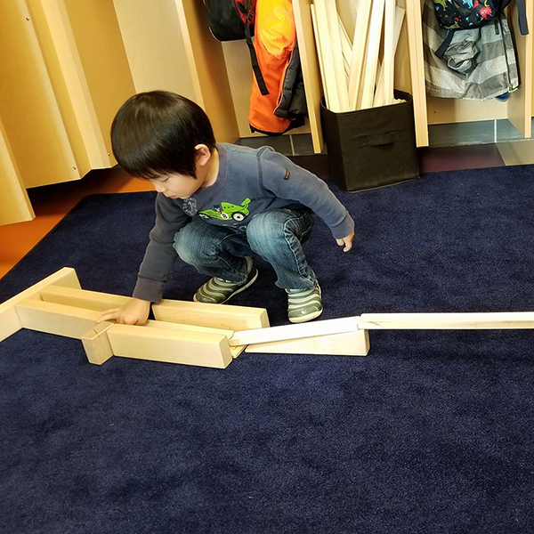 Child building a ramp.