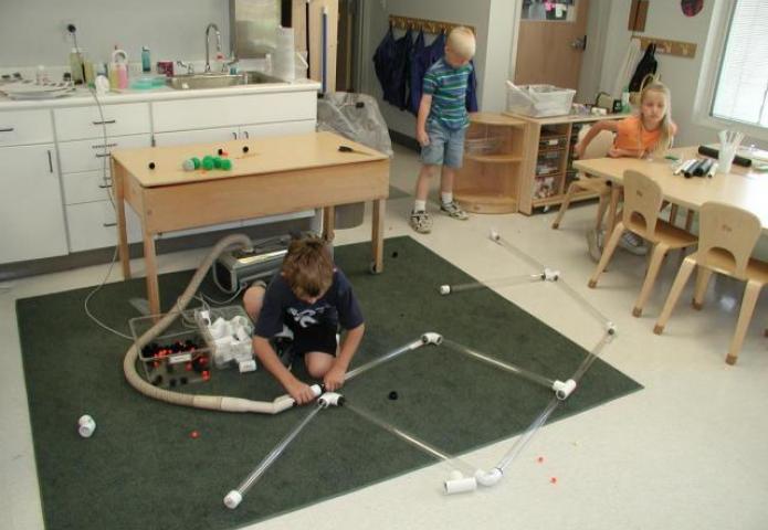 Children playing with tubes.