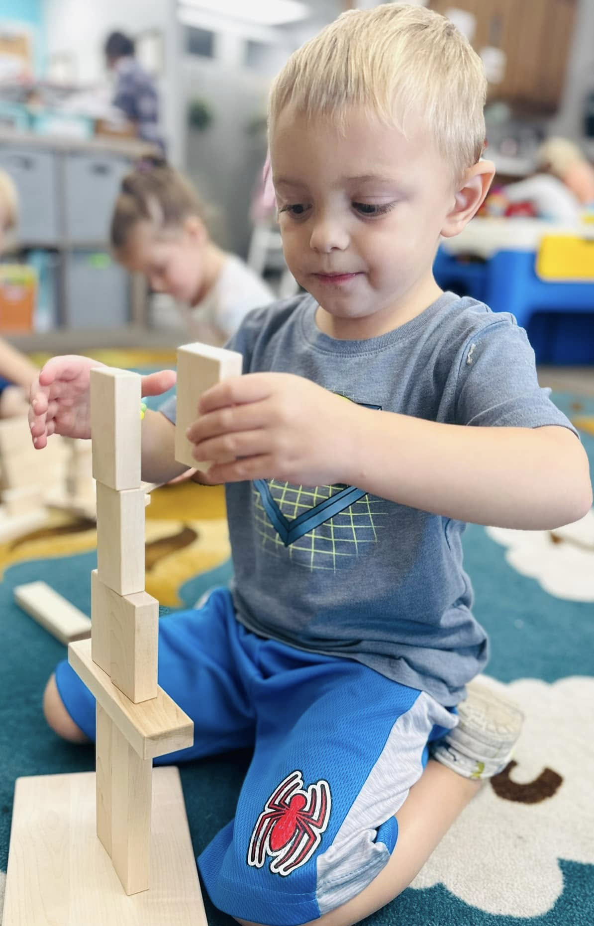 Young boy building with blocks