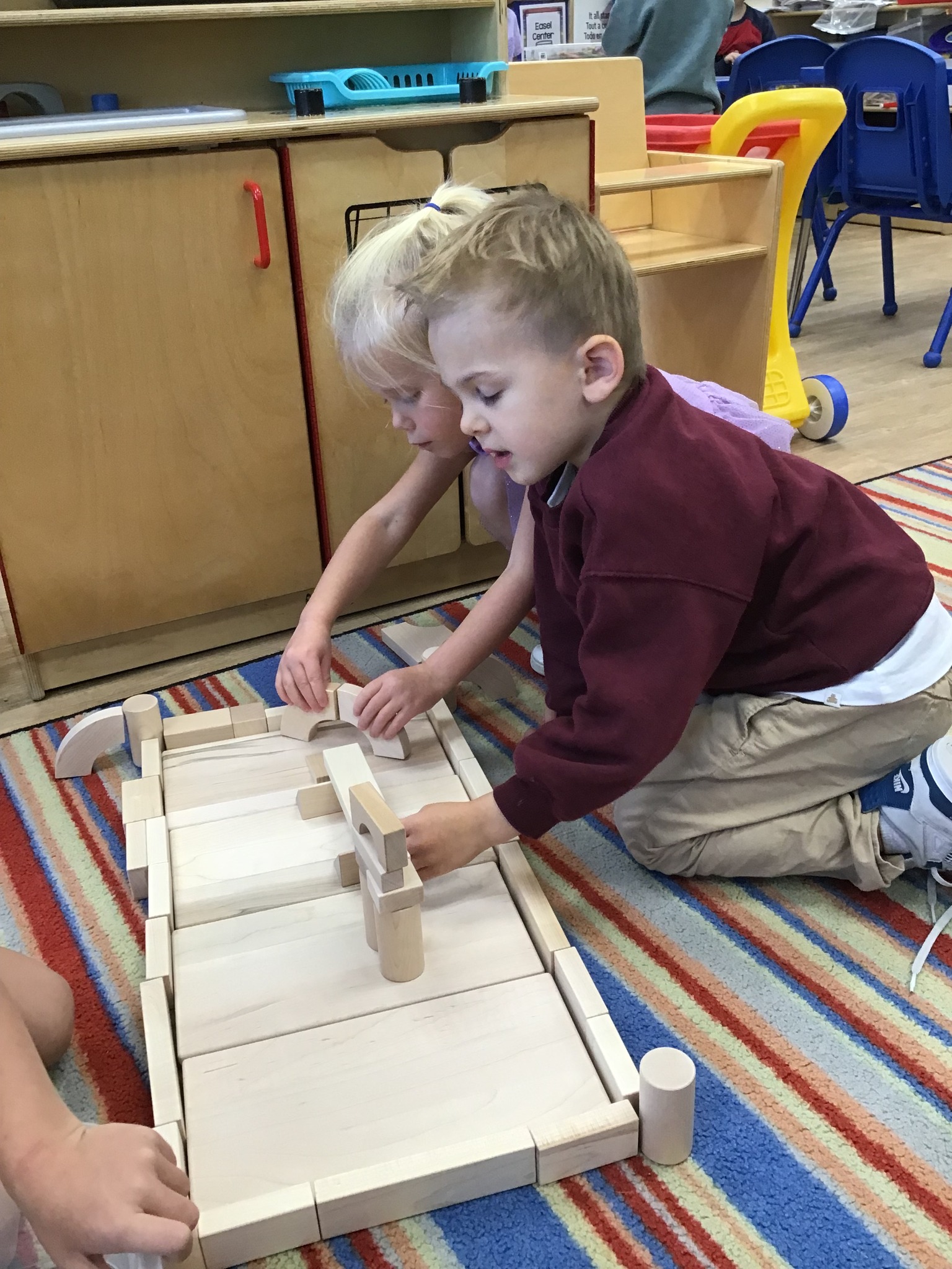 Young children building with blocks