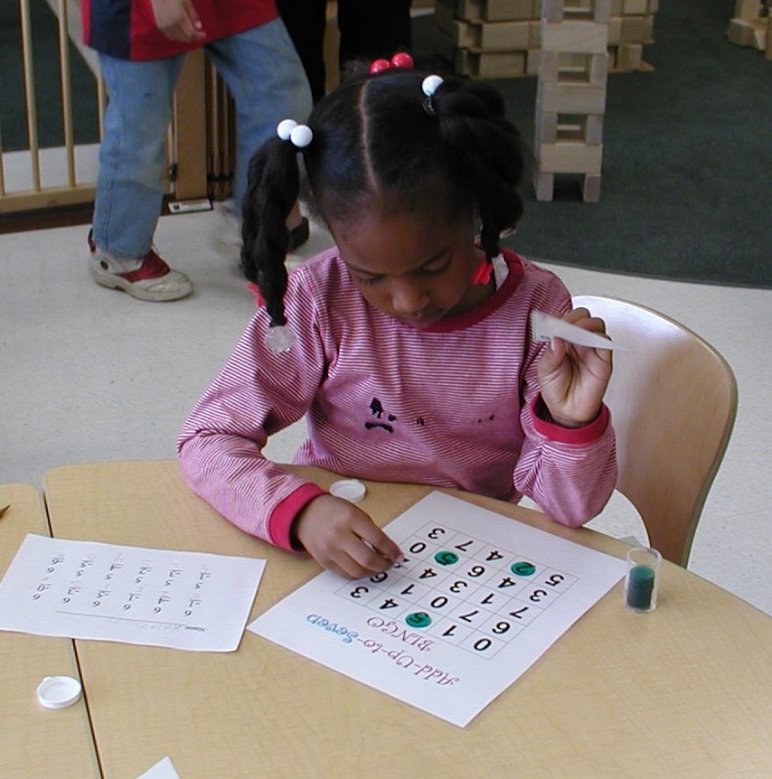 Young girl playing a board game