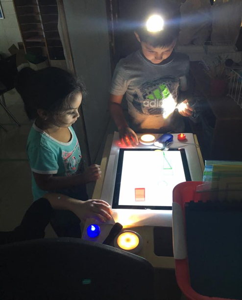 Children using the light table