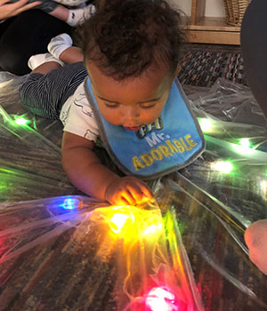 toddler inquiring about colorful lights