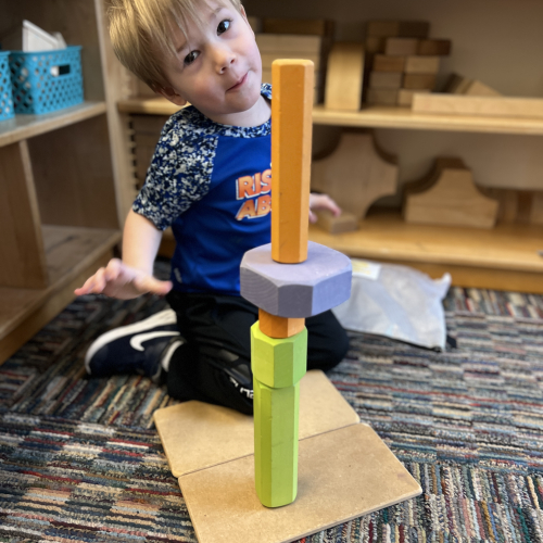 Toddler building with blocks