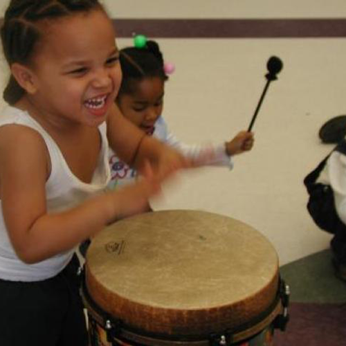 young boy playing the drum