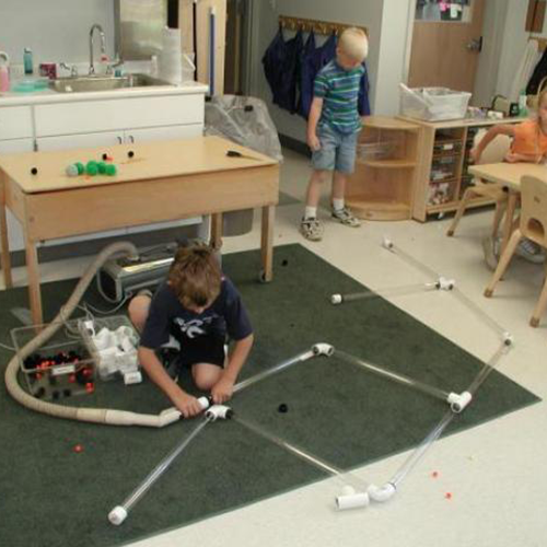 Child using pvc connectors and tubes for air to flow through